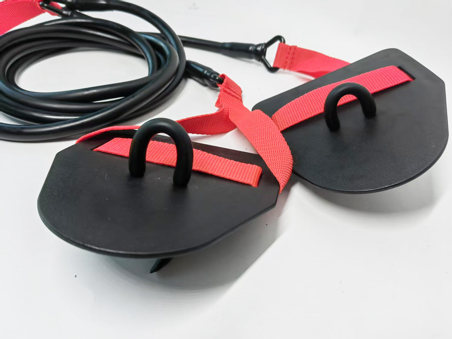 Swimming fitness cord with paddles